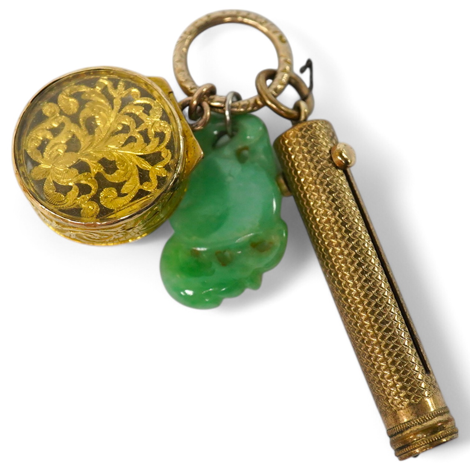 An unmarked yellow metal vinaigrette, 18mm, together with a yellow metal overlaid combination propelling pencil/penknife and a carved jade fob. Condition - fair to good.